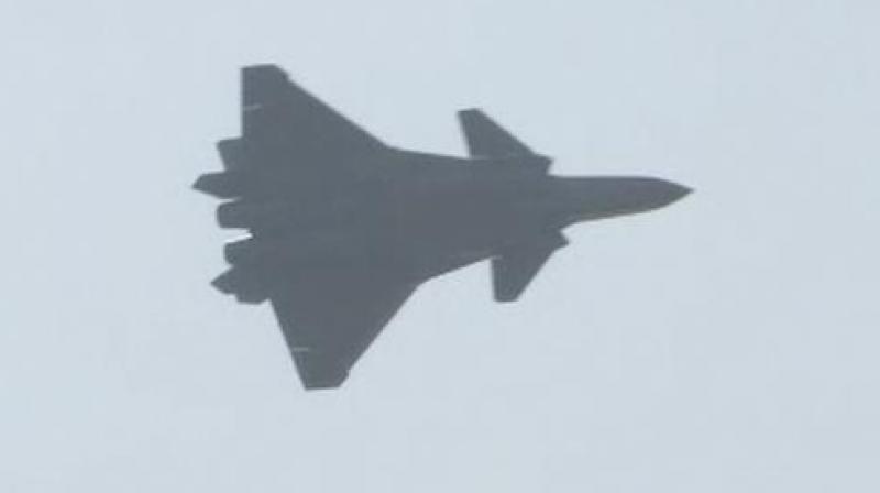 The J-20 stealth fighter jet flies at the Chinas International Aviation and Aerospace Exhibition in Zhuhai on Tuesday. (Photo: AP)