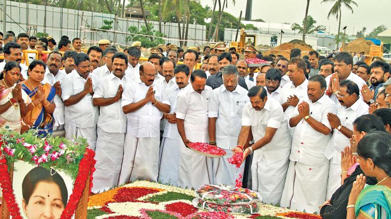 Chief Minister Edappadi K. Palaniswami, Deputy CM O. Panneerselvam and ministers pay floral tributes to late CM J. Jayalalithaa at her memorial on the Marina, at the conclusion of the Budget session on Monday (Photo: DC)