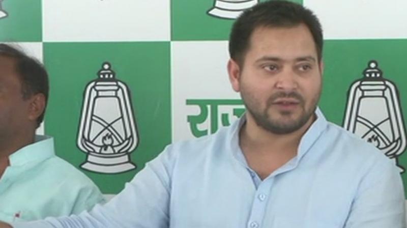 RJD leader Tejashwi Yadav also urged other opposition parties to unite and protest against the formation of government in Karnataka in the most undemocratic way. (Photo: ANI/Twitter)