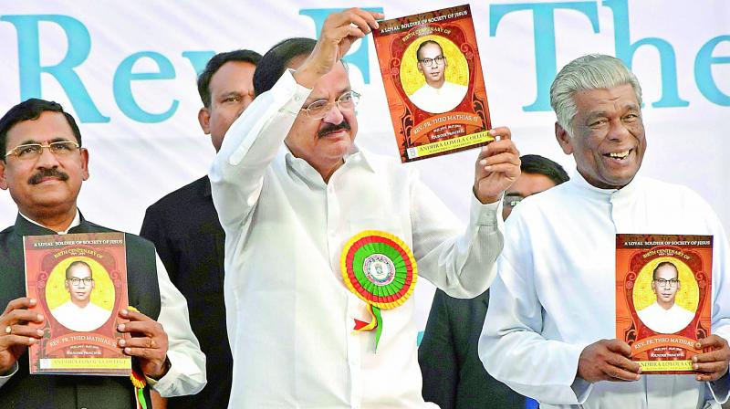 Vice-President M Venkaiah Naidu, Rev. Fr. Amalaraj and others release souvenirs during the 65th College Day celebrations of Loyola College in Vijayawada