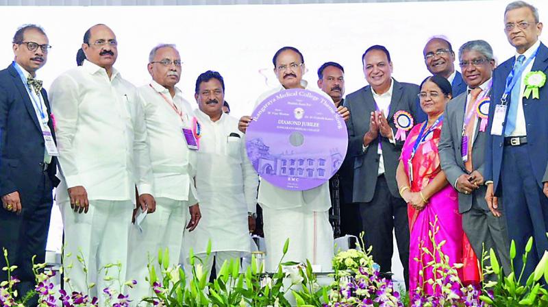 Vice-President M. Venkaiah Naidu releases theme song of Rangaraya Medical College during the college Diamond Jubilee celebrations in Kakinada on Saturday. Home minister N. Chinarajappa and others are seen.
