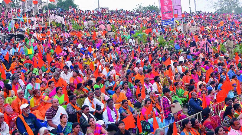 A large number of people take part in the chanting of Hanuman Chalisa, guided by Mysore seer Ganapathi Sachhidananda in Vijayawada on Saturday.  (Ch. Narayana Rao)