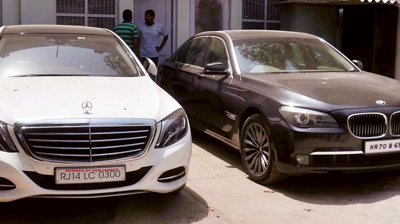 Two luxury cars which were recovered along with cash of Rs 1.5 crore from middleman Sukesh Chandra in connection with TTV Dinakaran bribe case, in New Delhi on Monday. (Photo: PTI)