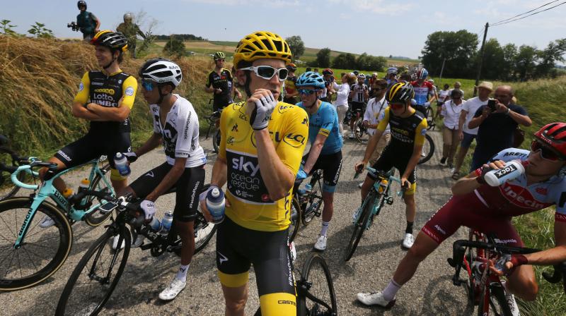 Among the riders affected by the tear gas was Team Skys overall leader Geraint Thomas, who was pictured rubbing his nose following the incident.(Photo: AP)