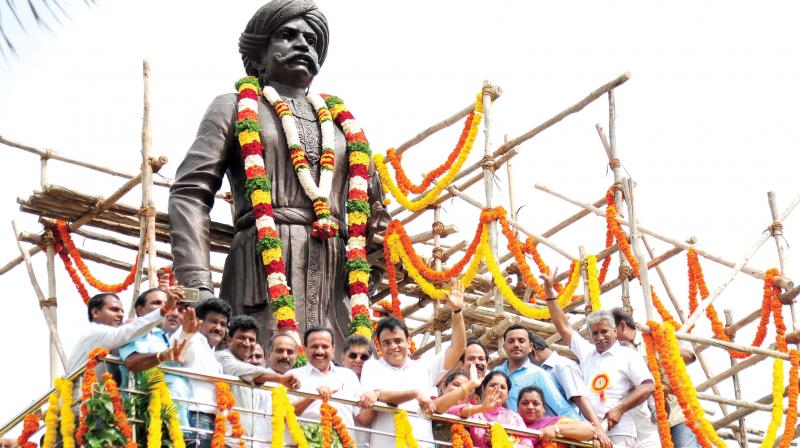 Union Minister D V Sadananda Gowda with actors Puneeth Rajkumar and others at the inauguration of Kempe Gowda statue near Mekhri Circle in Bengaluru on Tuesday. (Photo: DC)