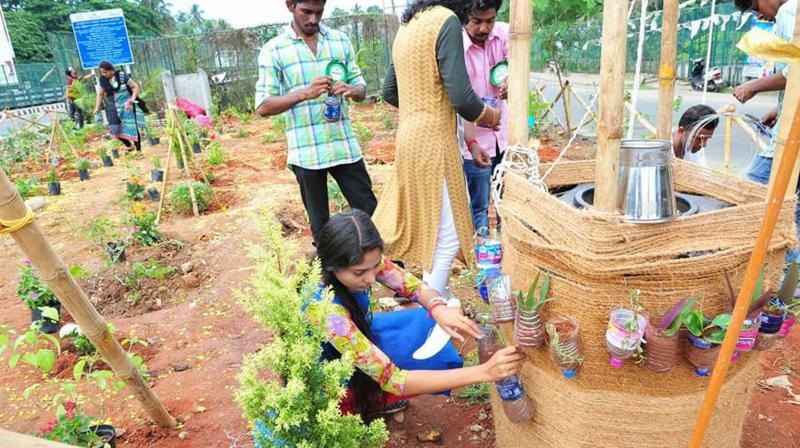 Members of Green and Clean Trivandrum set up an open garden on the Karmana Bridge in Thiruvananthapuram.