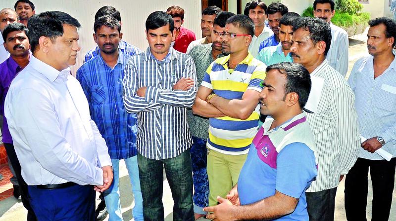 A few members of the group that returned from Iraq on Monday speak with the  resident commissioner of Telangana Bhavan in New Delhi, Arvind Kumar.