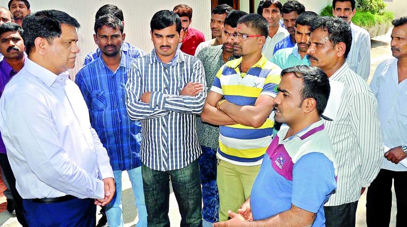 A few members of the group that returned from Iraq on Monday speak with the  resident commissioner of Telangana Bhavan in New Delhi, Arvind Kumar.