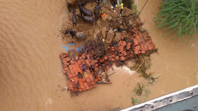 They seem to have drowned in the floodwaters. The bodies were found buried in muck, a police inspector at the scene said.