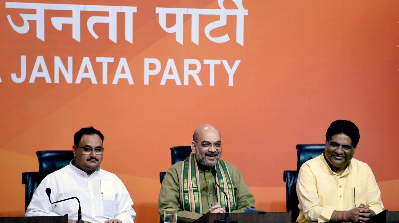 BJP President Amit Shah with party leaders JP Nadda and Bhupender Yadav. (Photo: PTI)