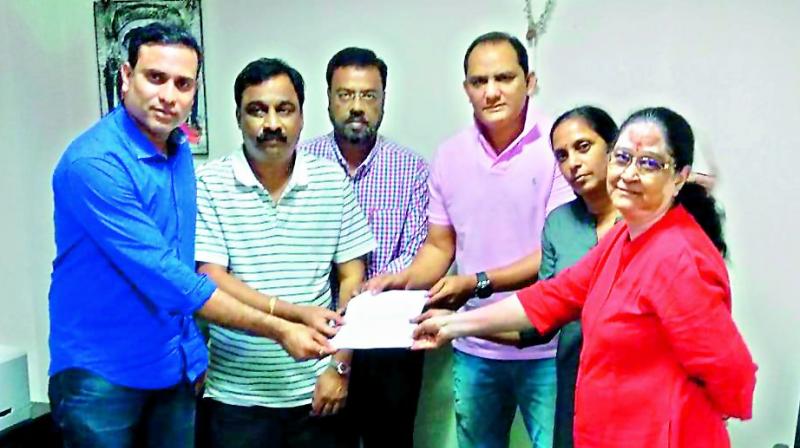 Members of the Cricket Players Association of Hyderabads steering committee VVS Laxman (left), Md Azharuddin (third from right), Rajani Venugopal (second from right) and Vidya Yadav (right) pose as they hand over names of selectors and coaching staff to Hyderabad Cricket Association secretary T. Sheshnarayan (second from left) and joint secretary Ajmal Asad at the Gymkhana grounds on Tuesday.