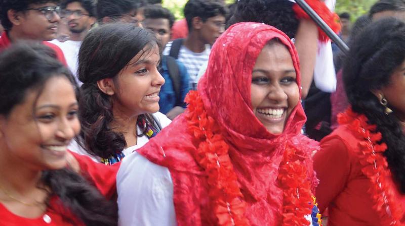 Jubilant students of SFI take out march after their victory in MG University union election on Tuesday.