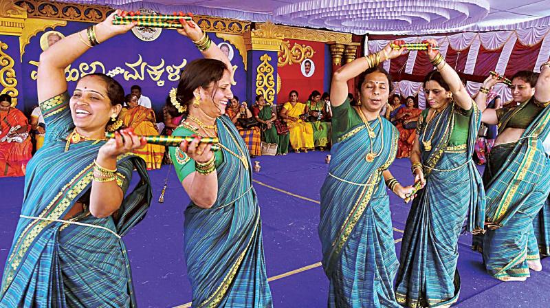 Women perform Kolata during the Women and Children Dasara organised in Mysuru on Tuesday.
