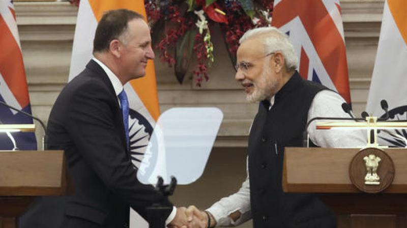 Prime Minister Narendra Modi, right, shakes hand with his New Zealands counterpart John Key after signing of document of agreement between the two countries in New Delhi. (Photo: AP)