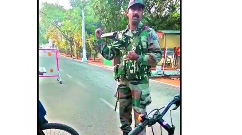 A screengrab of Army personnel stopping cyclists from entering on to Burr Road in Cantonment area.