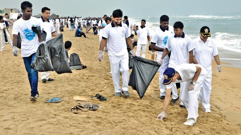 IG Rajan Bargotra, Commander Coast Guard Region (East), along with other volunteers, cleans the Elliots beach on International Coastal Cleanup Day organised by Indian Coast Guard region (East).