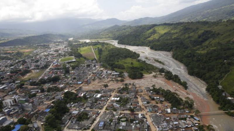 The mudslide hit late Friday after heavy rains caused three rivers to flood (Photo: AP)