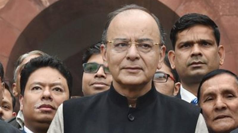 Finance Minister Arun Jaitley stands outside the North Block with the briefcase containing Union Budget for 2017 to be announced on Wednesday. (Photo: PTI)