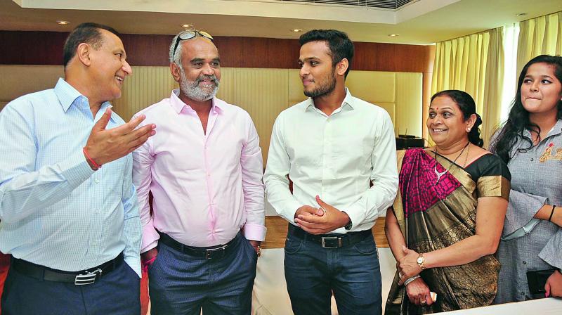 From Left: Rajiv Trivedi IPS, Hitarths father Savjibhai, Hitarth Ghanshyambhai Dholakia  and his mother Gauriben at a press conference in Hyderabad on Friday. (Photo: DC)