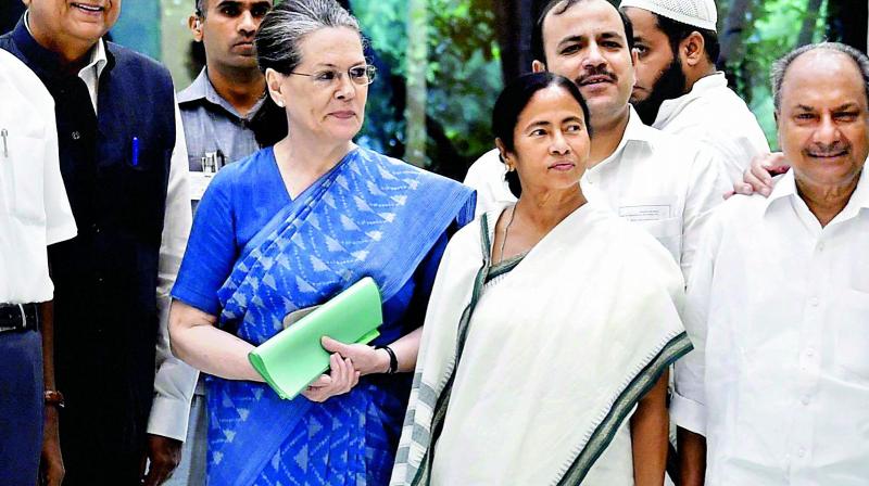 Congress President Sonia Gandhi, West Bengal CM Mamata Banerjee on Friday. (Photo: PTI)