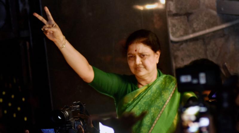 AIADMK General Secretary V K Sasikala flashes victory sign as she comes out to address media at Poes garden in Chennai. (Photo: PTI)