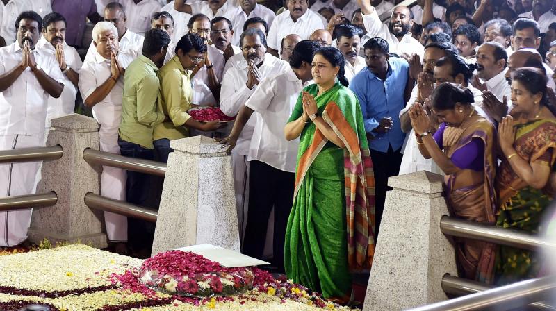 AIADMK General Secretary VK Sasikala paying tribute to J Jayalalithaa before meeting Governor Ch Vidyasagar Rao in Chennai. (Photo: PTI)