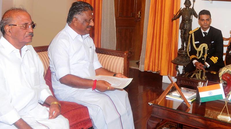 Tamil Nadu Chief Minister O Panneerselvam with former AIADMK Presidium Chairman Madhusudhanan. (Photo: PTI)