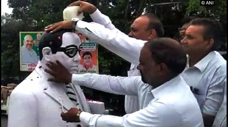 The lawyers said that the statue placed near the district court became dirty after BJP state secretary Sunil Bansal garlanded it. (Photo: ANI)
