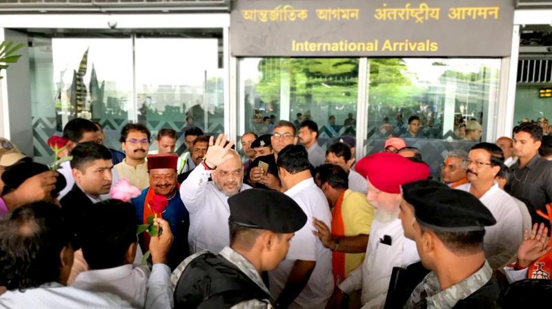 Amit Shah was received by state party-in charge Kailash Vijayvargiya and state party president Dilip Ghosh.  (Photo: Twitter | @KailashOnline)
