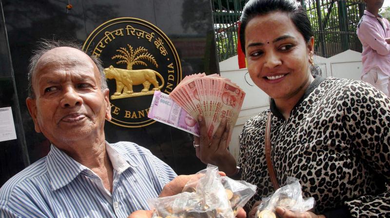 People after exchanging old currency notes with new ones at Reserve Bank of India in Bengaluru. (Photo: PTI)