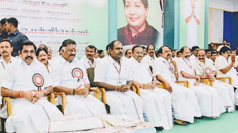 CM Edappadi K. Palaniswami and Deputy CM O. Panneerselvam greet party cadres  during the consultative meeting organised ahead of Thiruparankundram by-election, at Madurai, on Thursday. 	  Image; DC