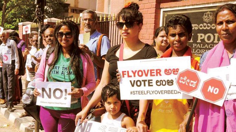 People of Bengaluru protesting against the steel flyover bridge project.