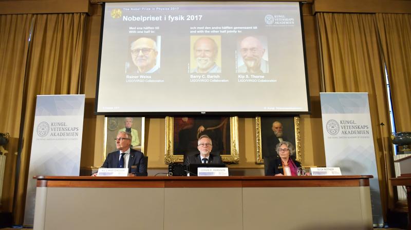 Goran K Hansson, centre, Secretary General of the Royal Swedish Academy of Sciences, announces the 2017 Nobel Prize winners in Physics, from top left, Rainer Weiss, Barry C. Barrish and Kip S. Thorne. (Photo: AP)