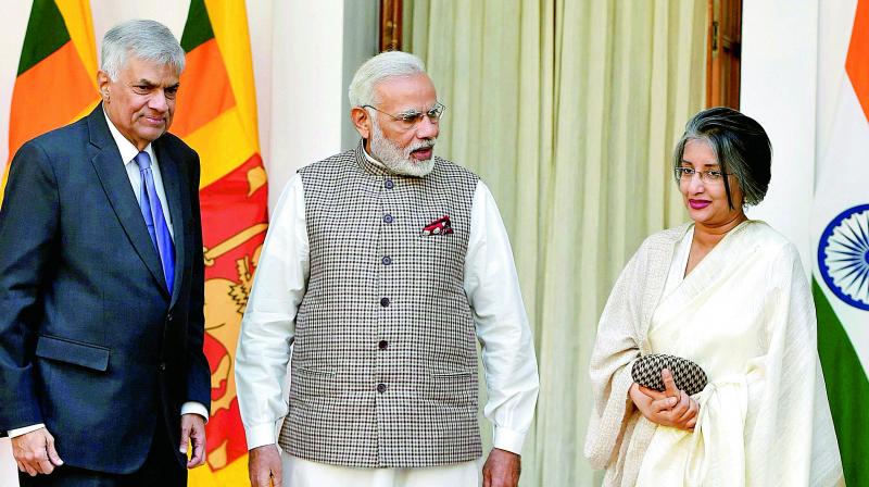 Prime Minister Narendra Modi with his Sri Lankan counterpart Ranil Wickremesinghe and his wife Maithree Wickramasinghe in New Delhi on Thursday. (Photo: PTI)