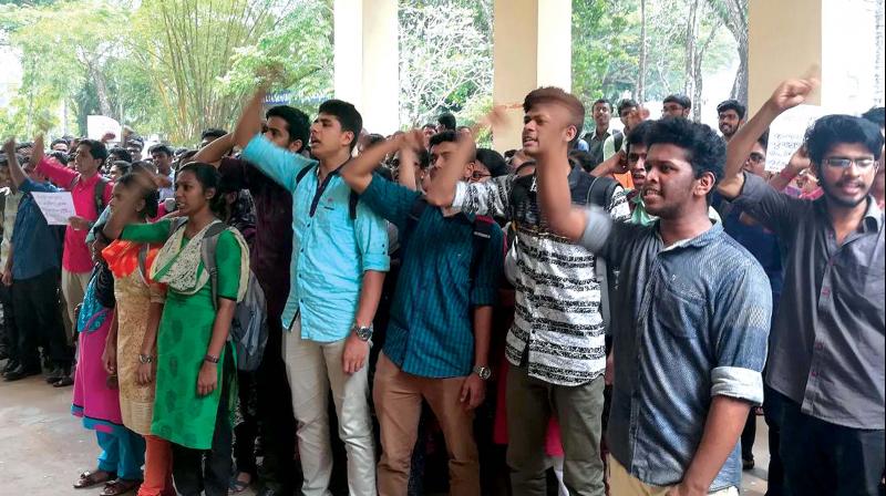 Medicos raise slogans at the medical college campus  in Thiruvananthapuram on Friday. 	 Arrangement
