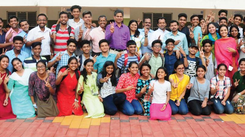 Thrissur Sahodaya students flash victory sign after winning the overall championship at the CBSE state youth festival held at IES Public School, Chittilappilly, Thrissur, on Saturday. 	(Photo: ANUP K. VENU)