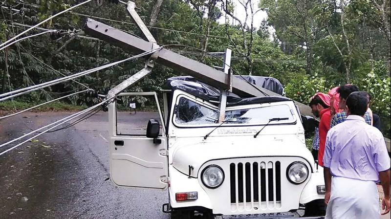 A post fell on a jeep at Amayar near Kattappana, Idukki.