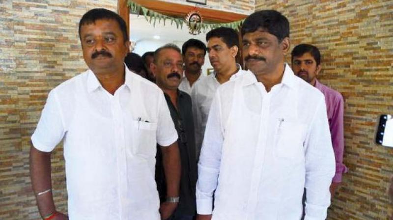 L. Chandrashekar (L) with Congress MP D.K. Suresh in Bengaluru on Thursday.