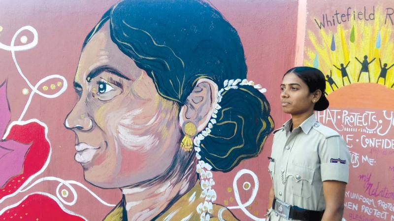 The profile of a female constable, Lakshmi, is painted across the entrance wall at the Whitefield Police station