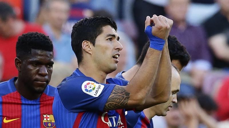 Luis Suarez took the MSN tally to 101 and killed the game off as a contest when he turned Jaume Costa and fired low and hard past Fernandez. (Photo: AP)