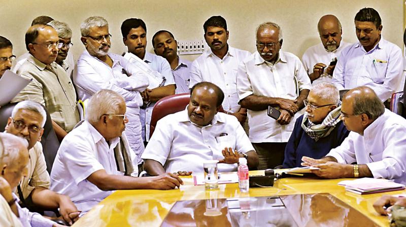 CM H.D. Kumaraswamy with a delegation of Kannada writers and leaders led by Chandrashekar Kambar at his home office Krishna in Bengaluru on Saturday 	(Image: KPN)