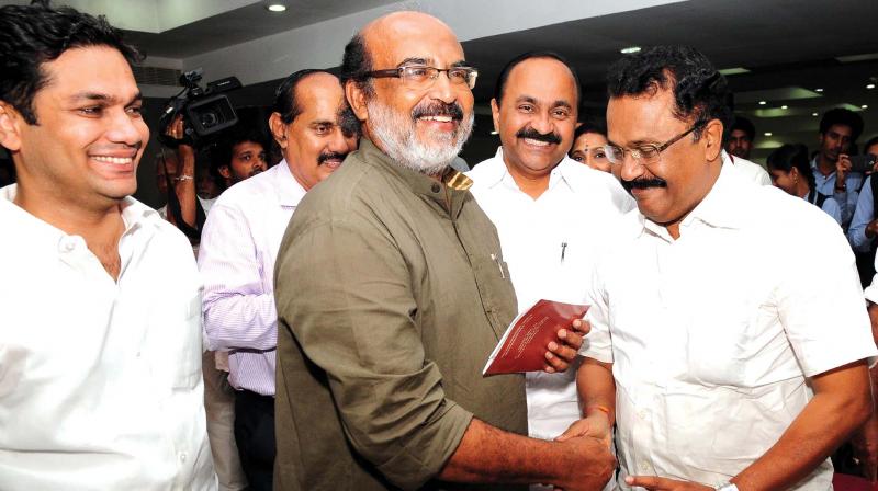 Finance minister Thomas Issac shares a light moment with BJP leader P.S. Sreedharan Pillai, Congress leader V.D. Satheeshan, MLA, and Hibi Eden, MLA,  during the seminar on Demonetisation of high value Currencies: Social & Economic Impact organised by Indian Professional Congress in Kochi on Tuesday.  (Photo: ARUNCHANDRA BOSE)