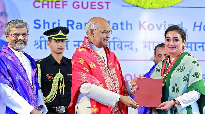 President Ram Nath Kovind presents a certificate to a student during the 7th convocation of Indian Institute of Technology Hyderabad at Kandi in Sangareddy district on Sunday.