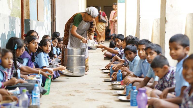Food being served to students.   (Image: DC)
