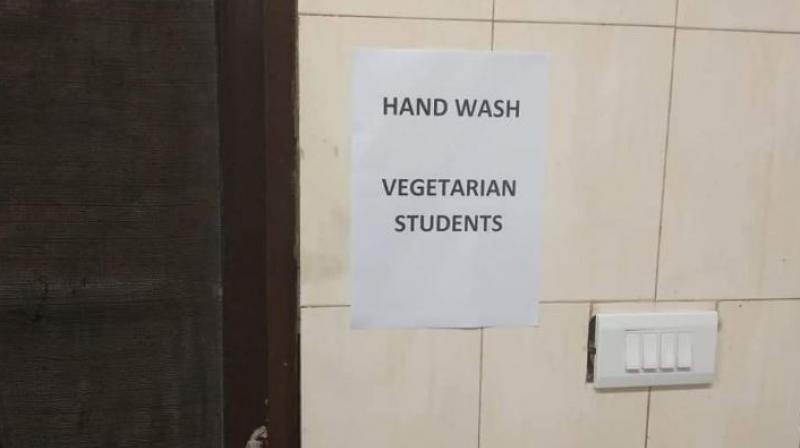 A student said posters had been put up near two entrances of north Indian mess located on second floor of Himalaya Mess Complex, specifying separate entry points and wash basins for non-vegetarian and vegetarian students. (Photo: Twitter | @ChintaBAR)