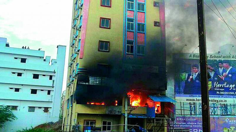 Fire broke out in a lodge in Shamshabad early on Wednesday. Around 50 people in the lodge were rescued. (Photo: DC)