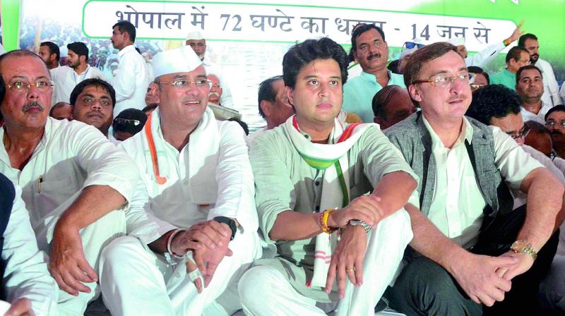 Congress leader and MP Jyotiraditya Scindia along with  Rajya Sabha MP Vivek Tankha during the 72-hour satyagraha, in Bhopal on Wednesday. (Photo: PTI)