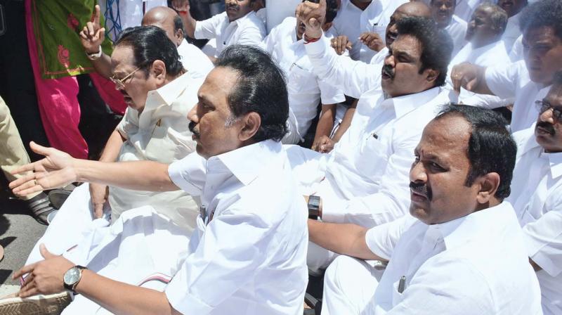 Opposition leader and DMK working president M.K. Stalin along with DMK MLAs and Congress members stage a road roko outside the Secretariat Complex by blocking the Kamarajar Salai in Chennai on Wednesday. (Photo: DC)