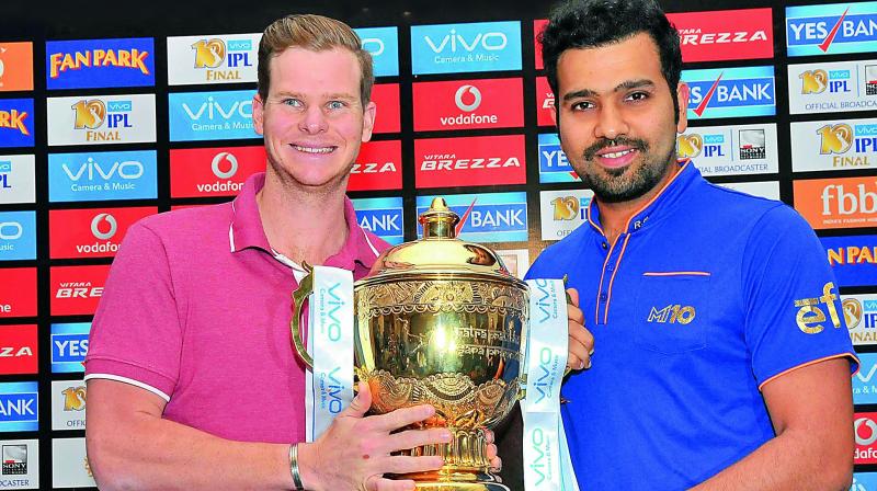 Rising Pune Supergiant captain Steve Smith (left) and Mumbai Indians skipper Rohit Sharma pose with the IPL Trophy on Saturday, eve of the final in Hyderabad. (Photo: P. Surendra)