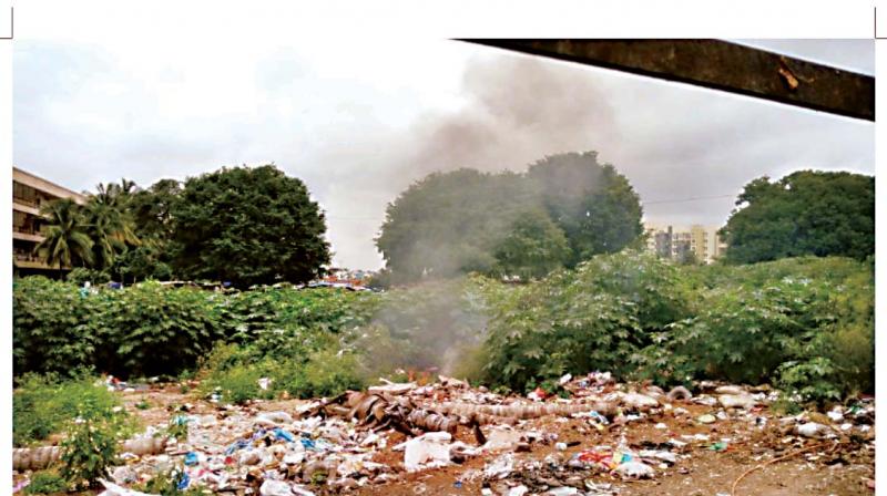 Garbage being burnt at Yelachenahalli.
